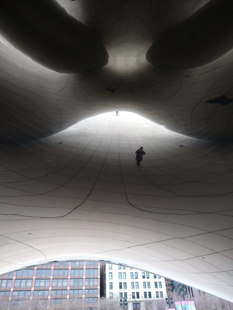 A photo taken underneath Anish Kapoor's Cloud Gate in Chicago